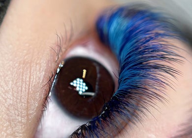 Close-up of eye with vibrant blue lashes at Cami_beautyart BANK • CITY OF LONDON, London, England, GB.