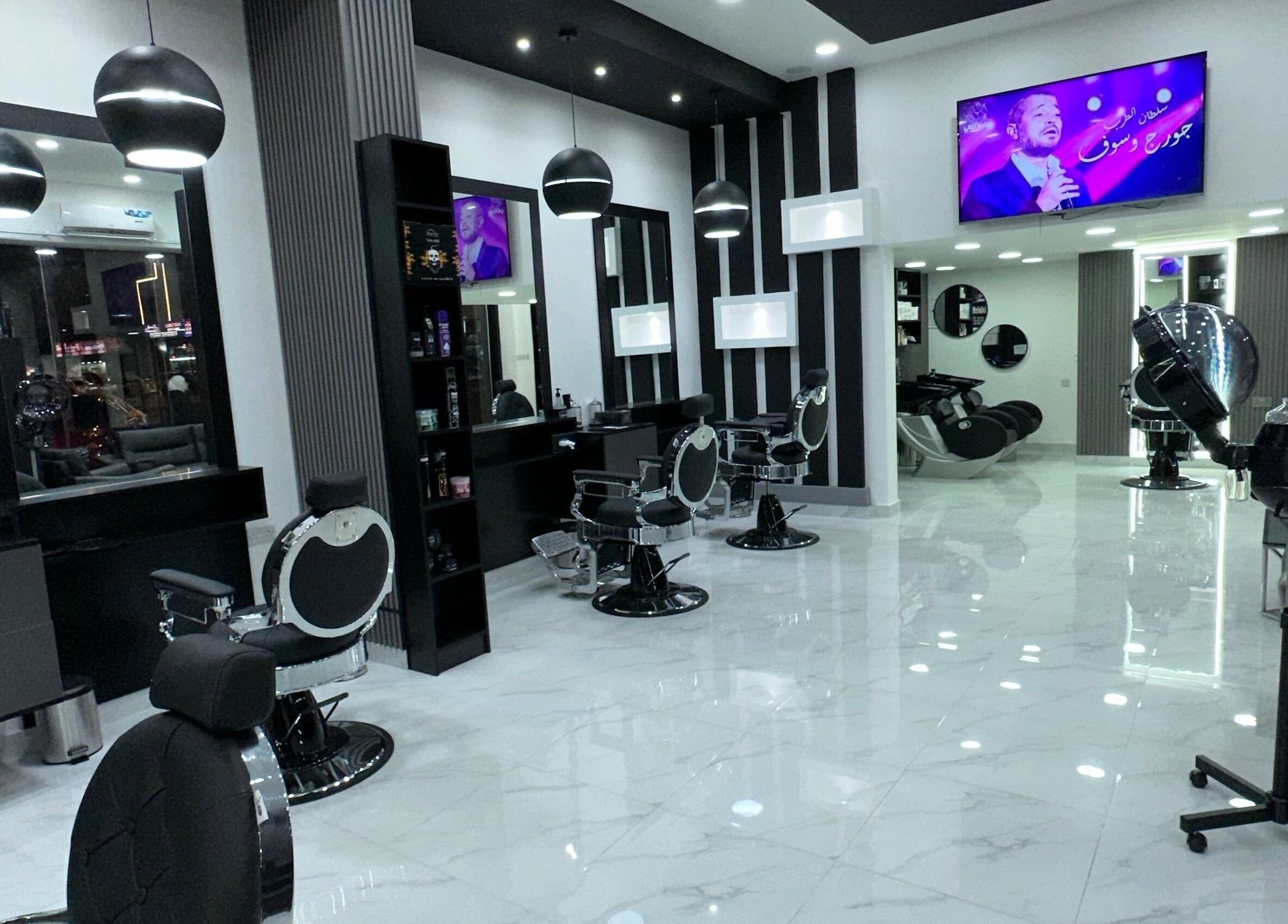 Modern interior of AL AMEER AL MALAKI GENTS SALON in Sharjah offers premium grooming services in a stylish setting.