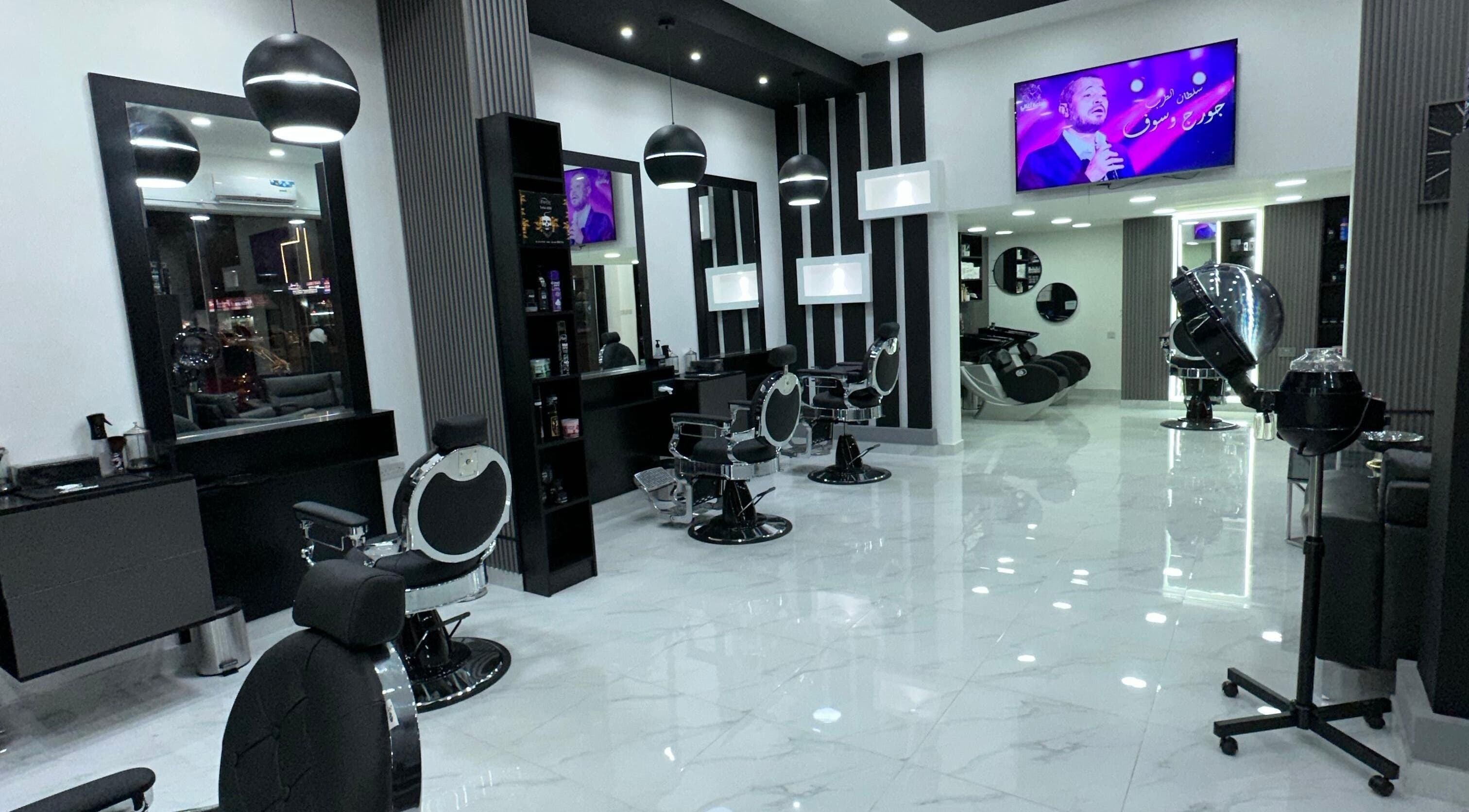 Modern interior of AL AMEER AL MALAKI GENTS SALON in Sharjah offers premium grooming services in a stylish setting.