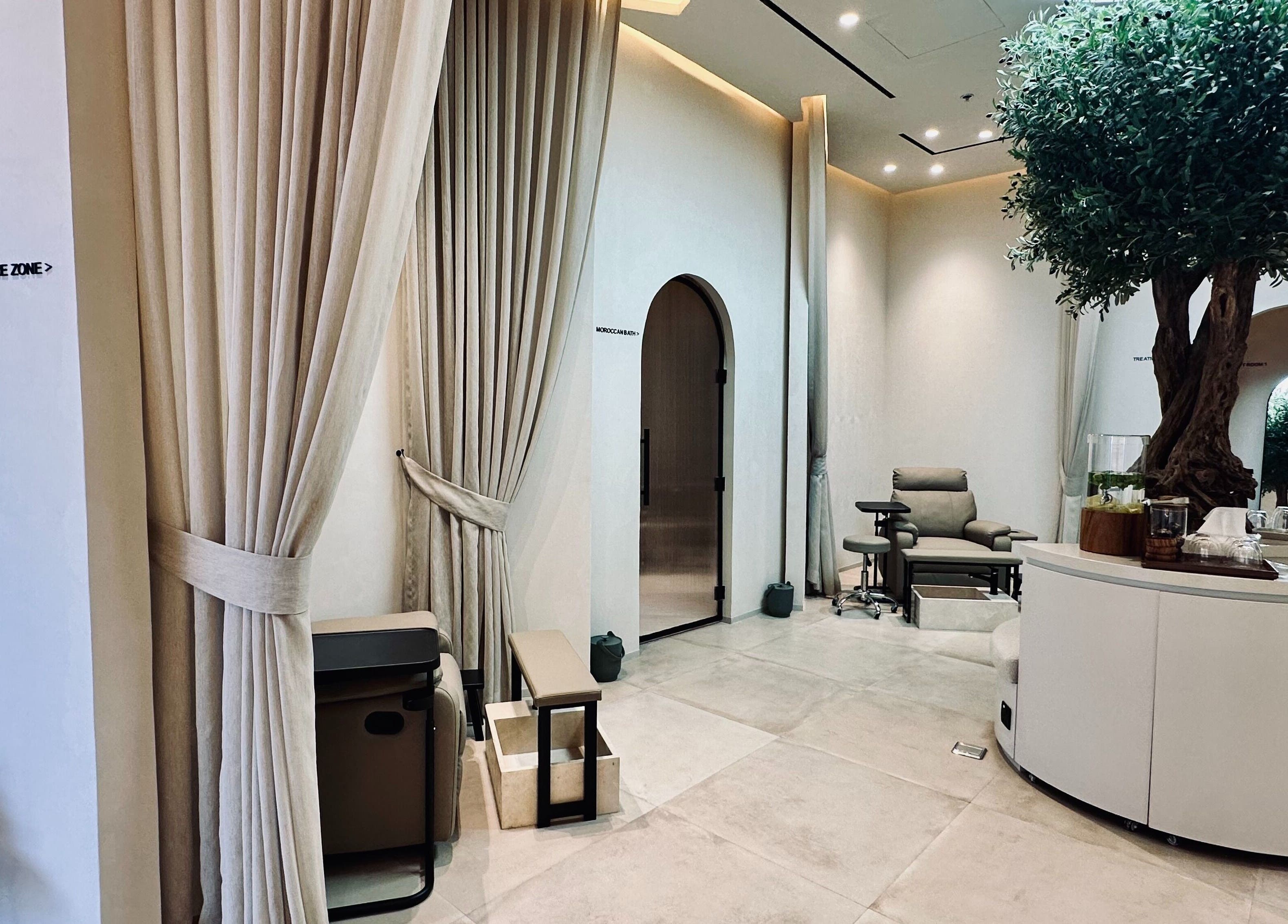 Relaxing and elegant interior of Olea Wellness Beauty Salon, Dubai, Dubai, AE, featuring plush seating and decor.