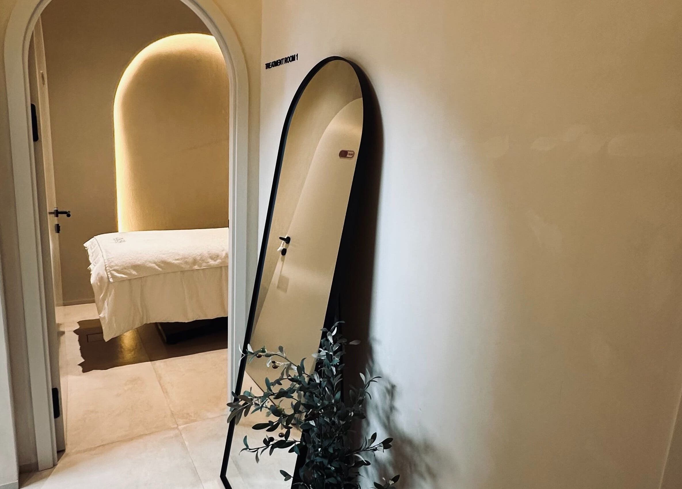 Cozy treatment room at Olea Wellness Beauty Salon, Dubai, Dubai, AE, featuring a bed and elegant decor.
