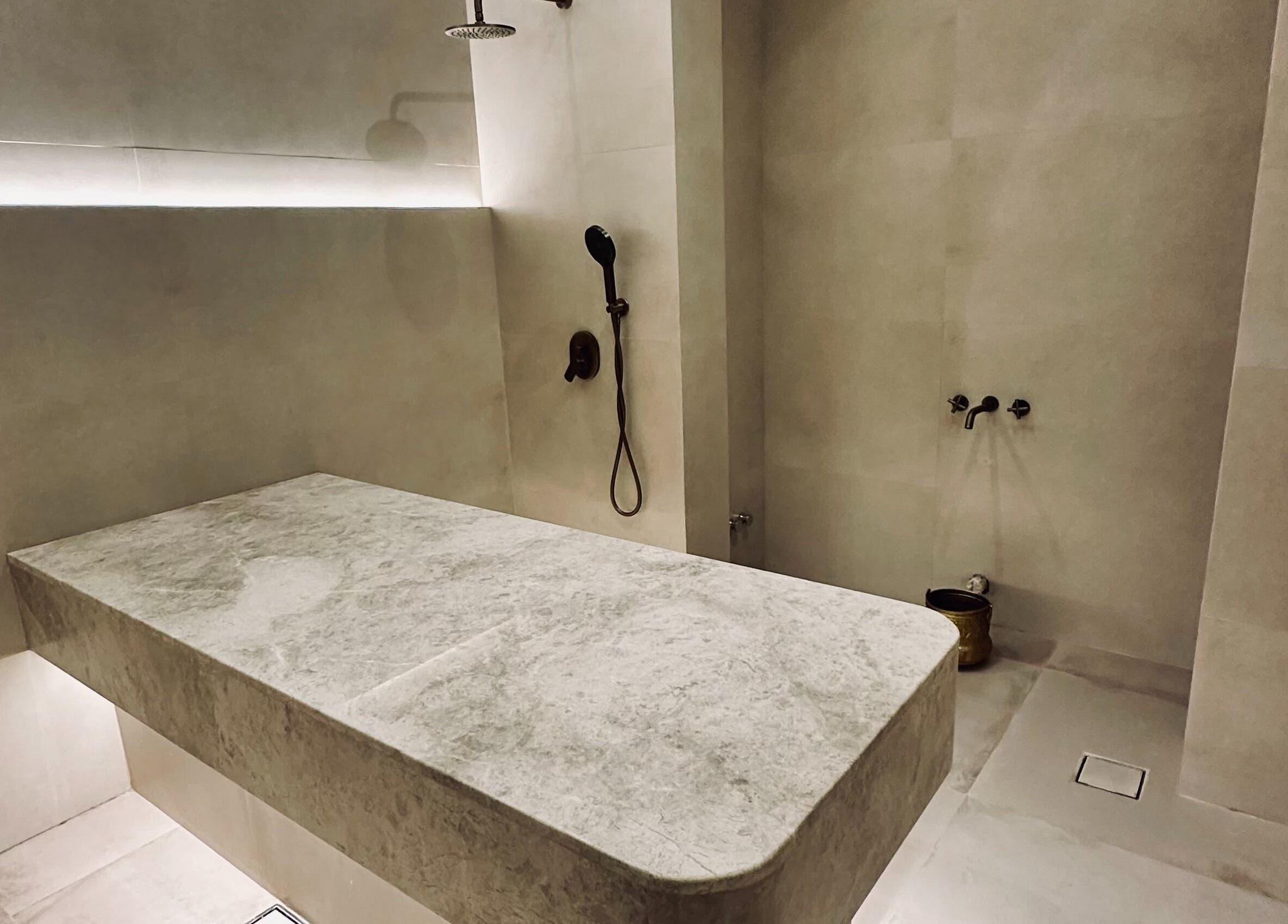 Luxurious spa treatment room at Olea Wellness Beauty Salon, Dubai, Dubai, AE, with elegant stone decor.