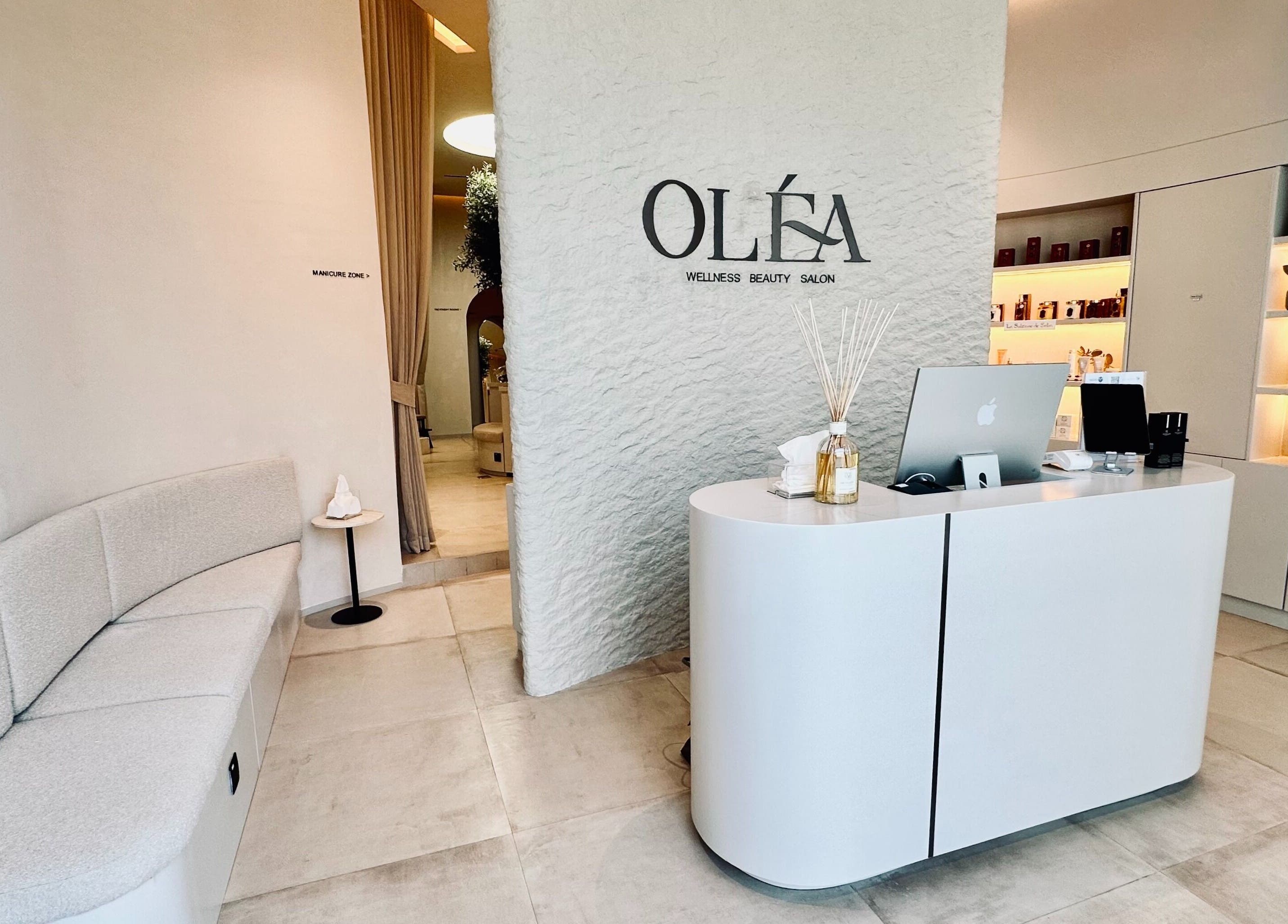 Reception area of Olea Wellness Beauty Salon, Dubai, Dubai, AE, featuring modern design and soothing ambiance.