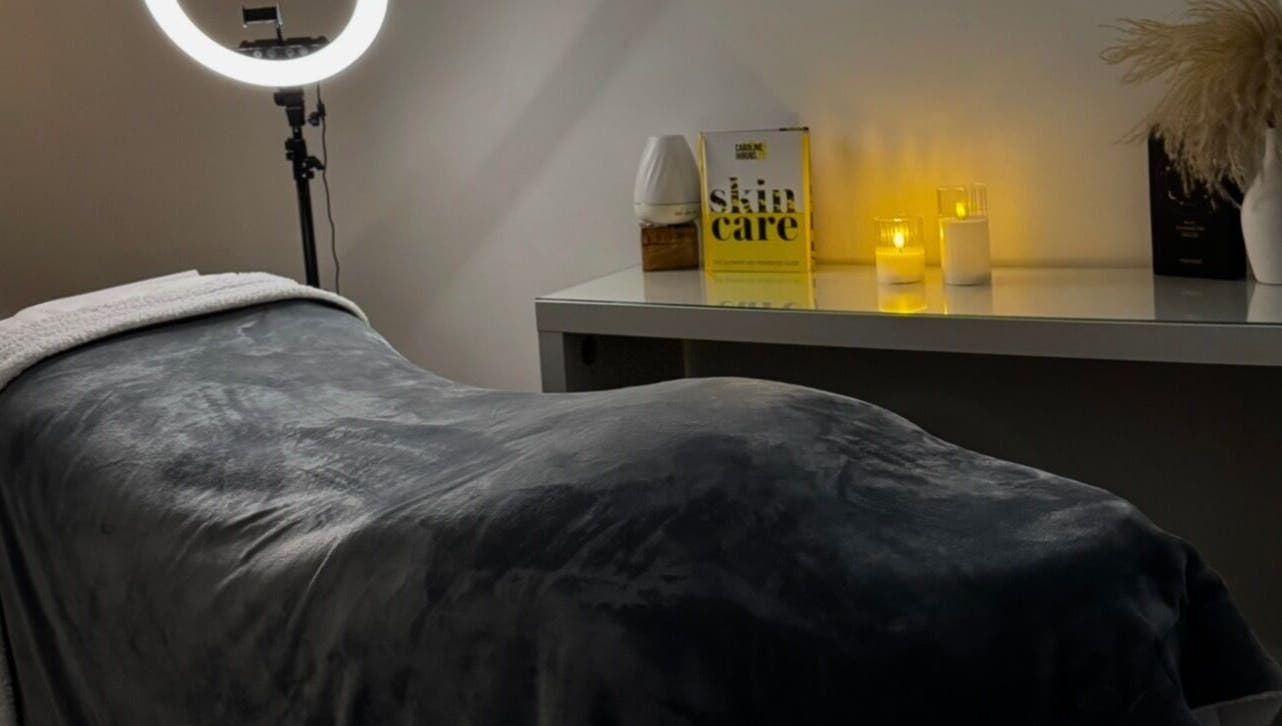 Tranquil treatment room at Nu Glow by Teri, Worsley, England, GB, featuring a plush bed and soft lighting.