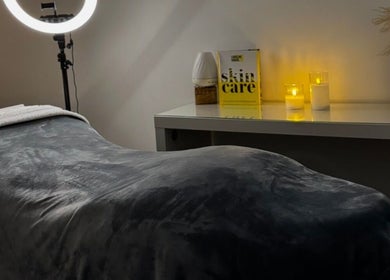 Tranquil treatment room at Nu Glow by Teri, Worsley, England, GB, featuring a plush bed and soft lighting.