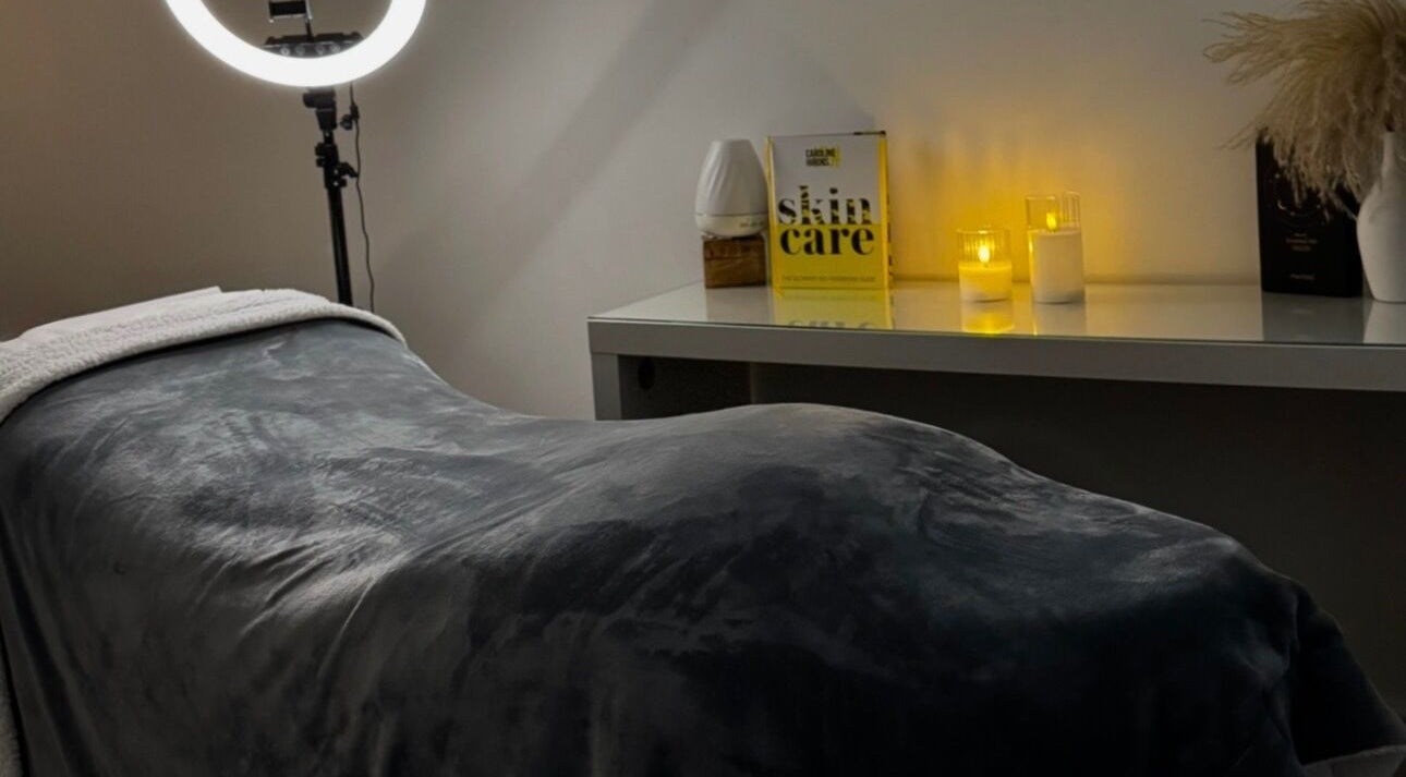 Tranquil treatment room at Nu Glow by Teri, Worsley, England, GB, featuring a plush bed and soft lighting.