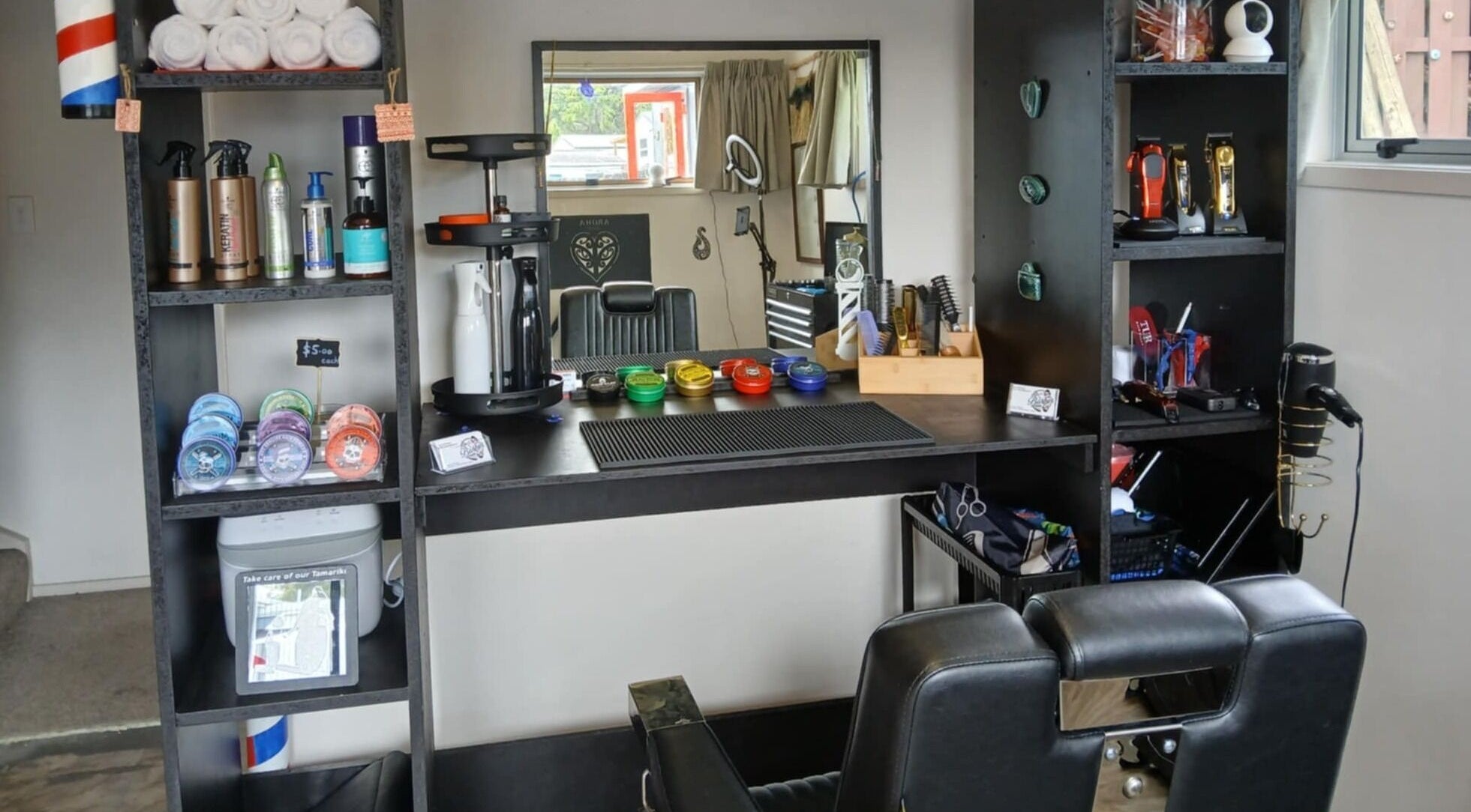 Chic grooming station at BBI Barbers, Whangārei, Northland, NZ, featuring hair products and tools.