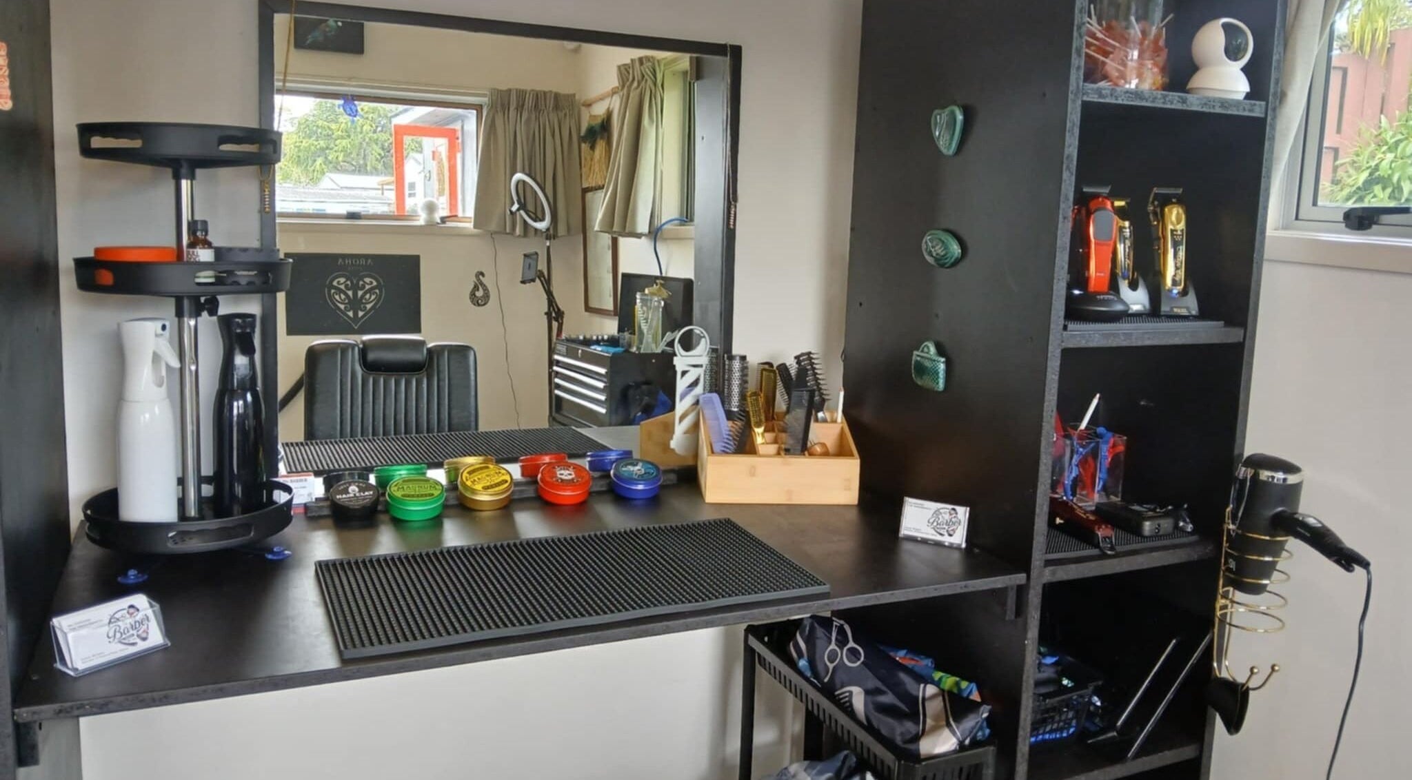 BBI Barbers grooming station in Whangārei, Northland, NZ with tools and styling products.