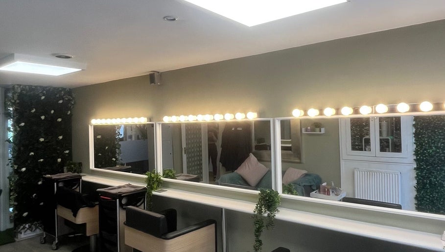 ErinLeylandHair salon in Accrington, England with illuminated mirrors and seating stations.