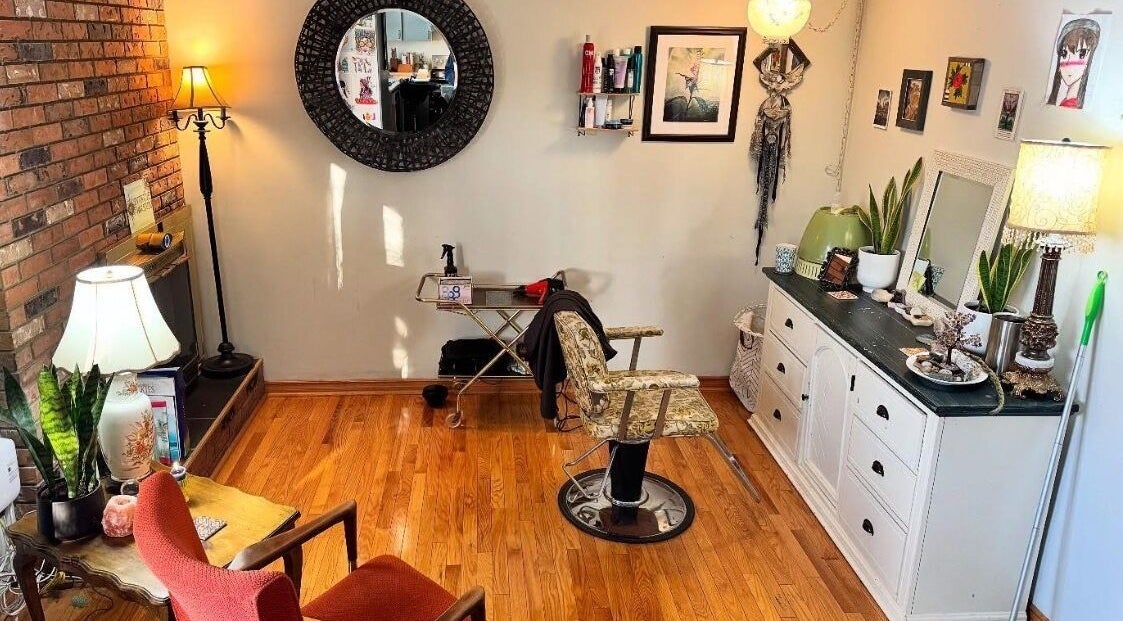 Cozy interior of Intuitive Hair Studio in Edmonton, Alberta, CA featuring rustic decor and hair styling chair.