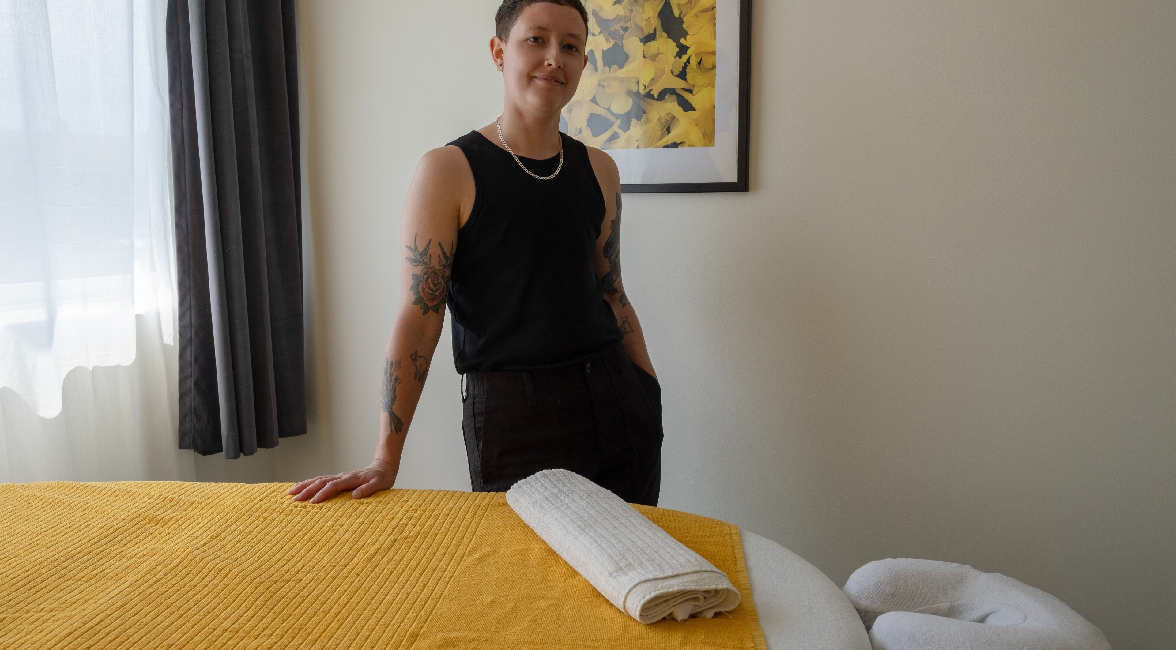 A relaxing treatment room at Massage by Ayden in Margate, England, GB, featuring a massage table with a rolled towel.