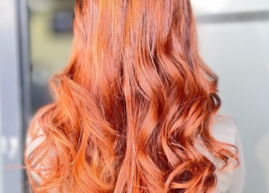 Vibrant curly hairstyle at Inhibition Hair & Beauty Salon, Telford, England, GB.