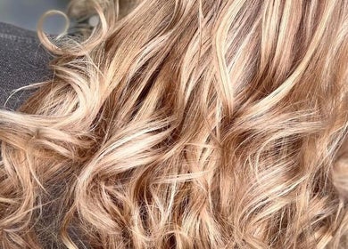 Blonde curls styled at Inhibition Hair & Beauty Salon, Telford, England, GB.