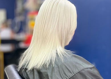 Elegant platinum blonde hairstyle at Inhibition Hair & Beauty Salon, Telford, England, GB.