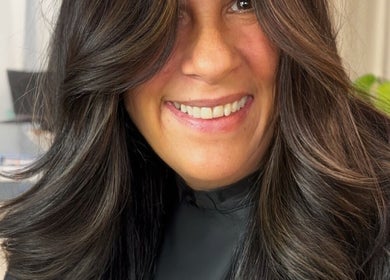 Smiling woman with styled hair at Cream Hair Artistry by Tove, Southport, Queensland, AU.