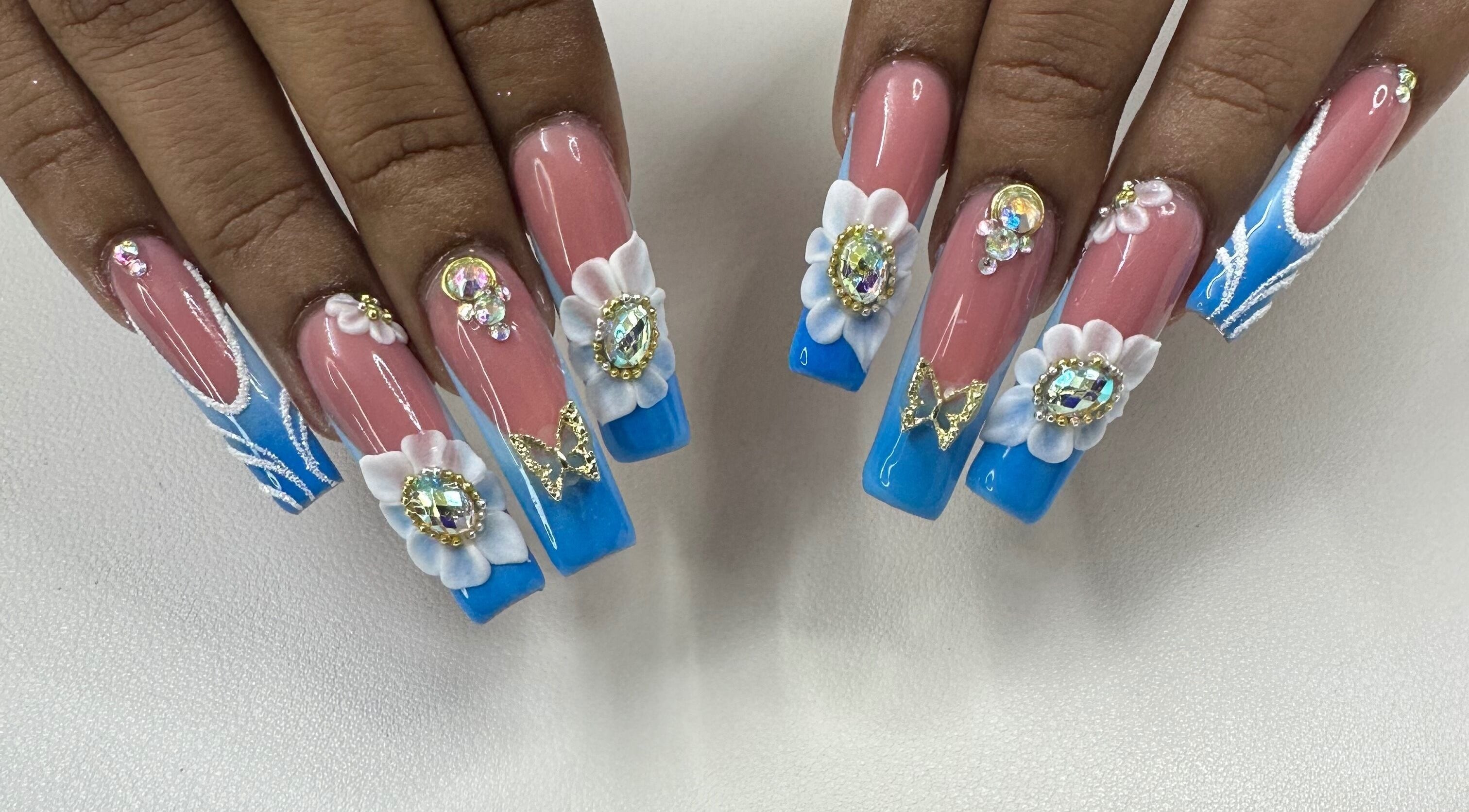 Intricate 3D nail art with gemstones and flowers at Brushed Wonders Salon New York, New York, US.