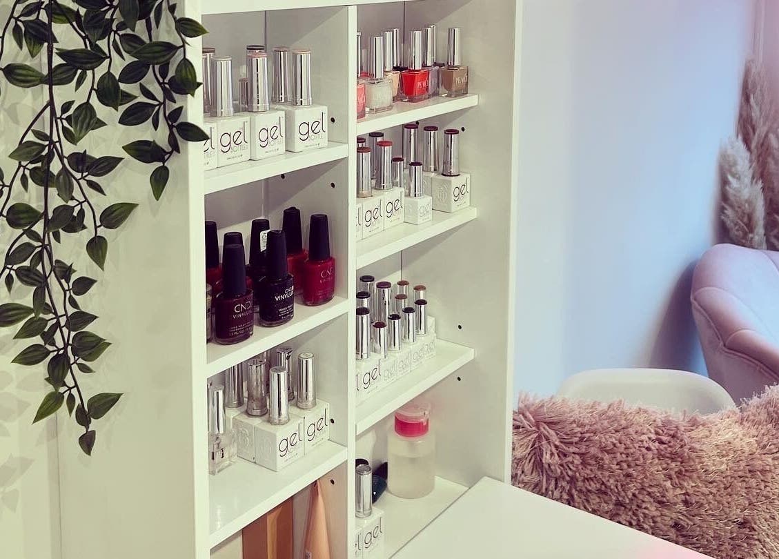 Beauty by Felicity nail polish display and cozy pink chair at Addlestone, England, GB.