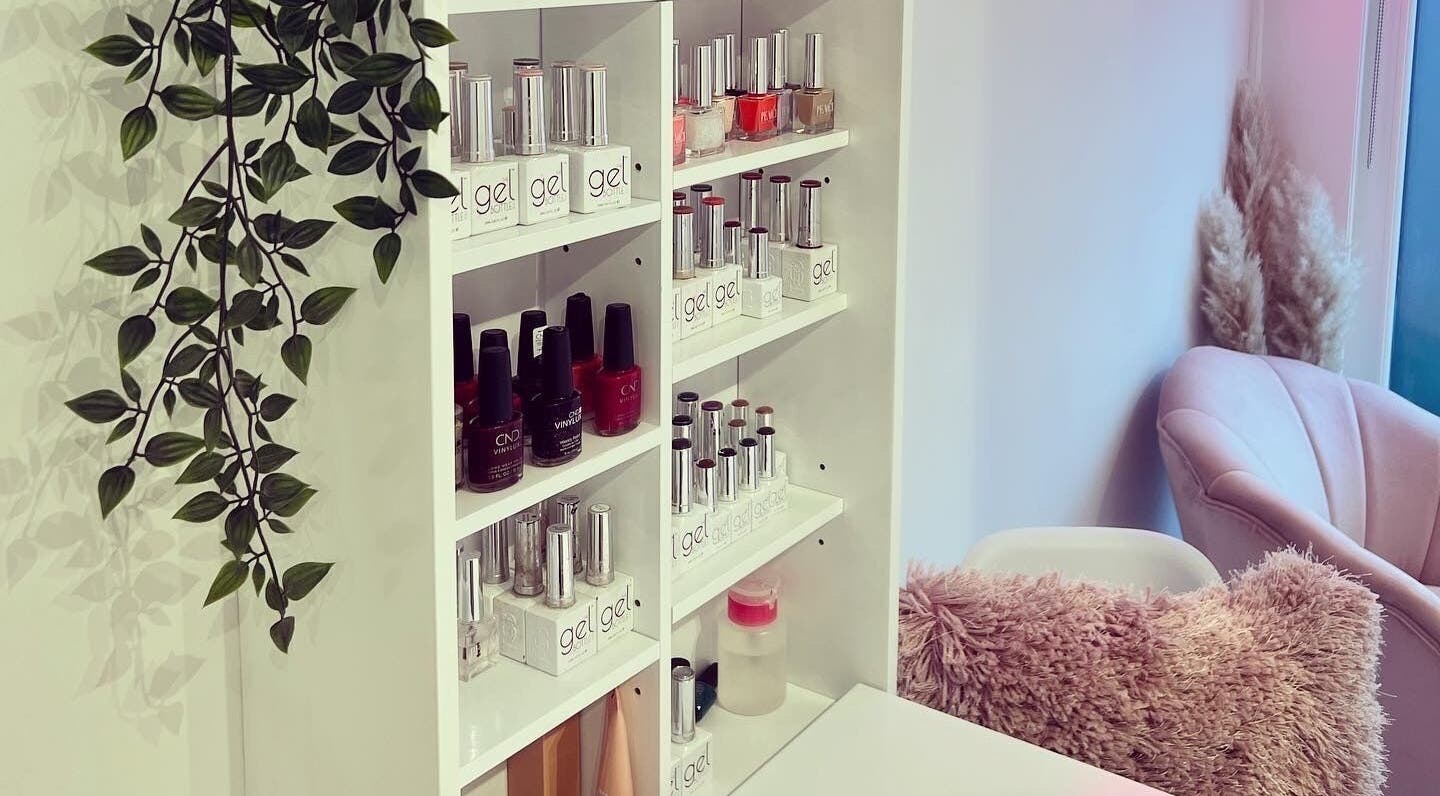 Beauty by Felicity nail polish display and cozy pink chair at Addlestone, England, GB.