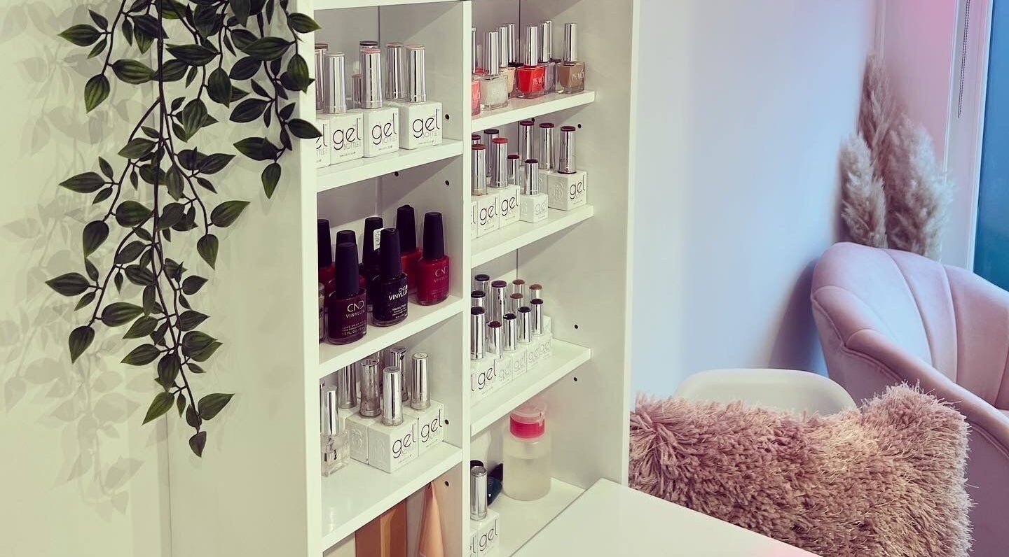 Beauty by Felicity nail polish display and cozy pink chair at Addlestone, England, GB.