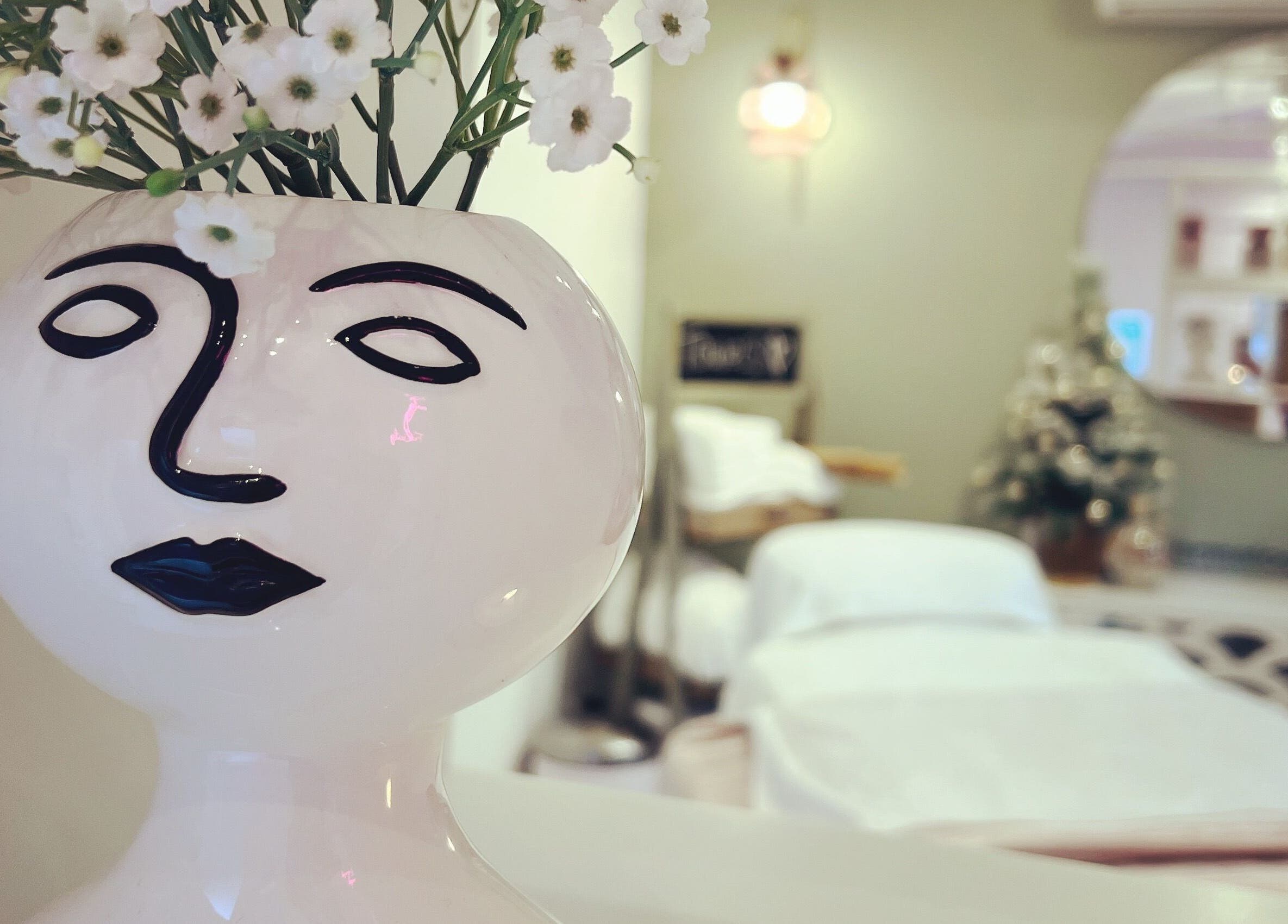 Artful vase with flowers in relaxing room at Beauty by Felicity, Addlestone, England, GB