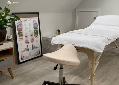 Calming reflexology room at Carole Coram Reflexology, Buckden, England, GB, showcasing a treatment table.