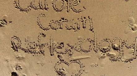 Carole Coram Reflexology etched in sand at Buckden, England, GB beach.