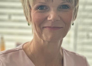 Relaxed professional at Carole Coram Reflexology, Buckden, England, GB, enhancing your wellness journey.