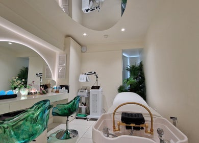 Modern treatment room at Hairmonic Head Spa, London, England, GB, featuring chic decor and advanced spa equipment.