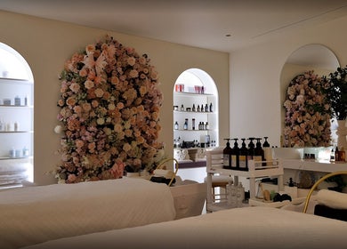 Tranquil interior of Hairmonic Head Spa London with floral decor and products, London, England, GB.