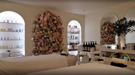 Tranquil interior of Hairmonic Head Spa London with floral decor and products, London, England, GB.