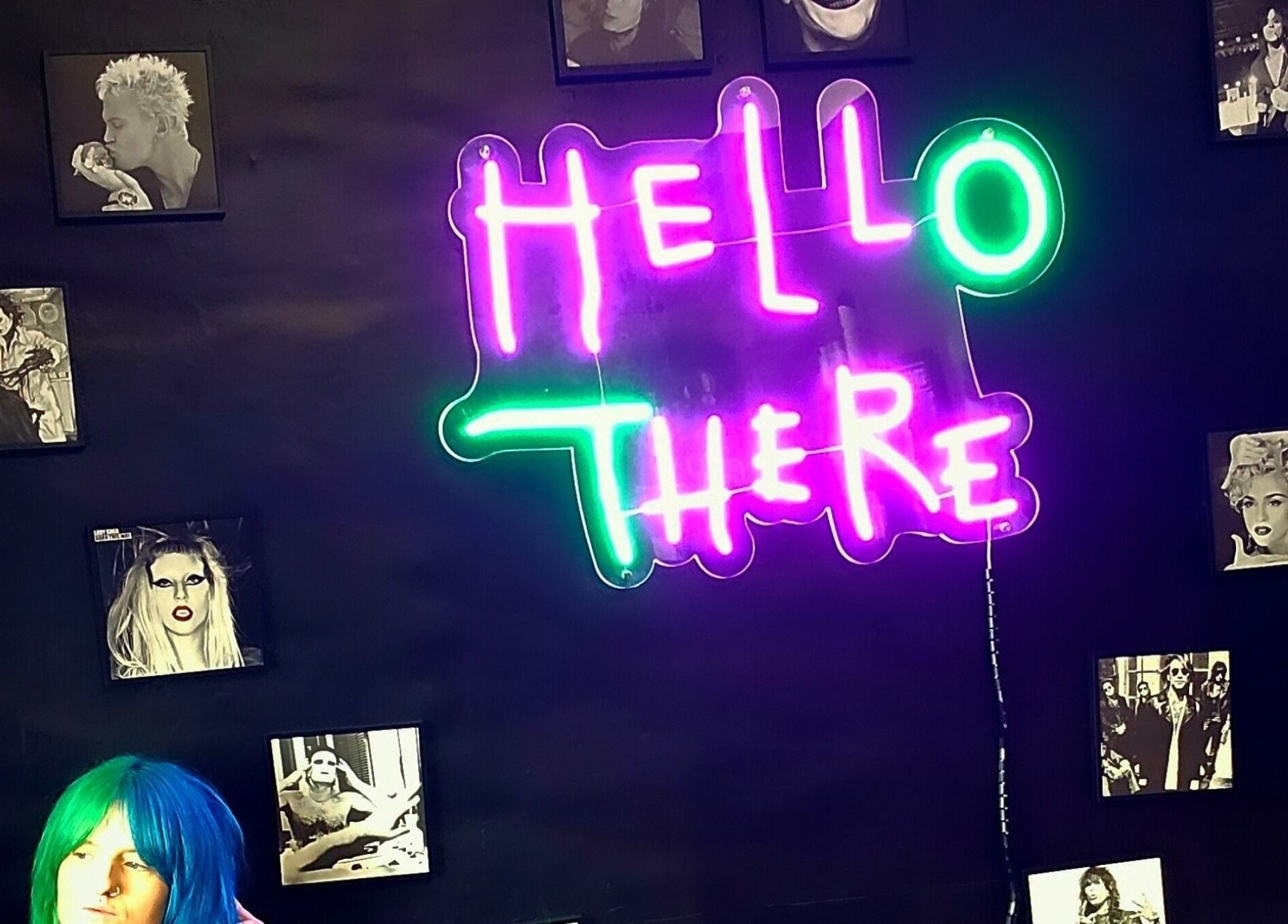 Neon 'Hello There' sign at Rebel Manes, Drogheda, County Louth, IE, with vibrant wall art.