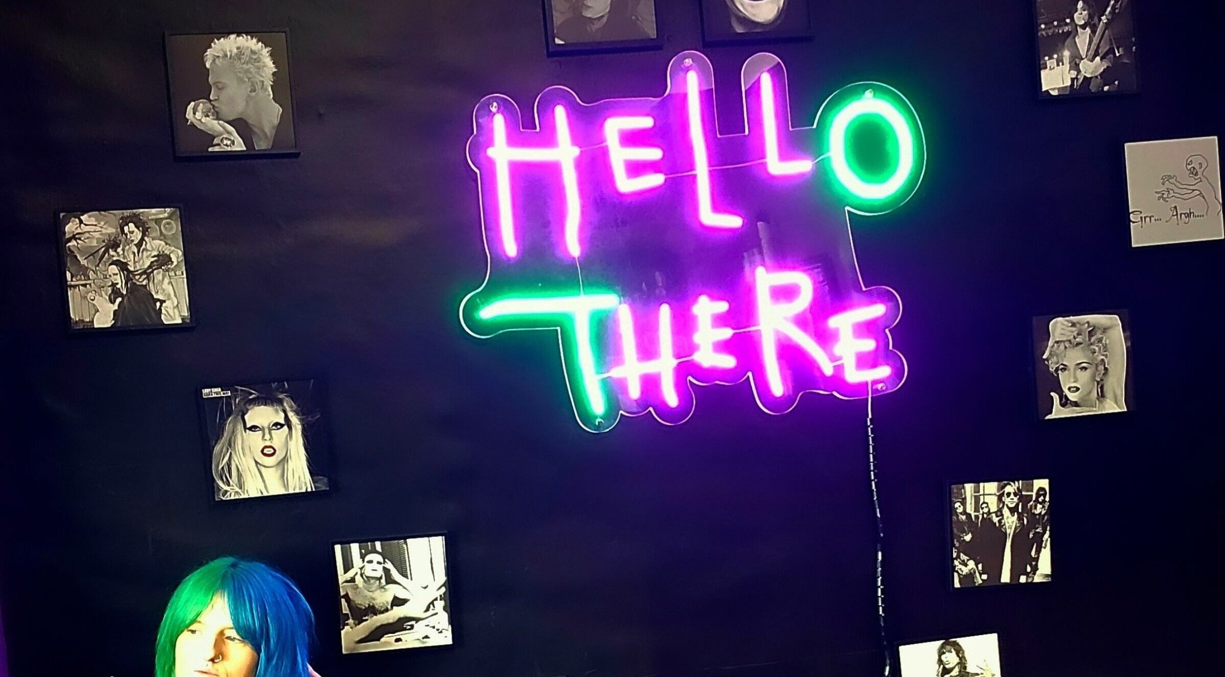 Neon 'Hello There' sign at Rebel Manes, Drogheda, County Louth, IE, with vibrant wall art.