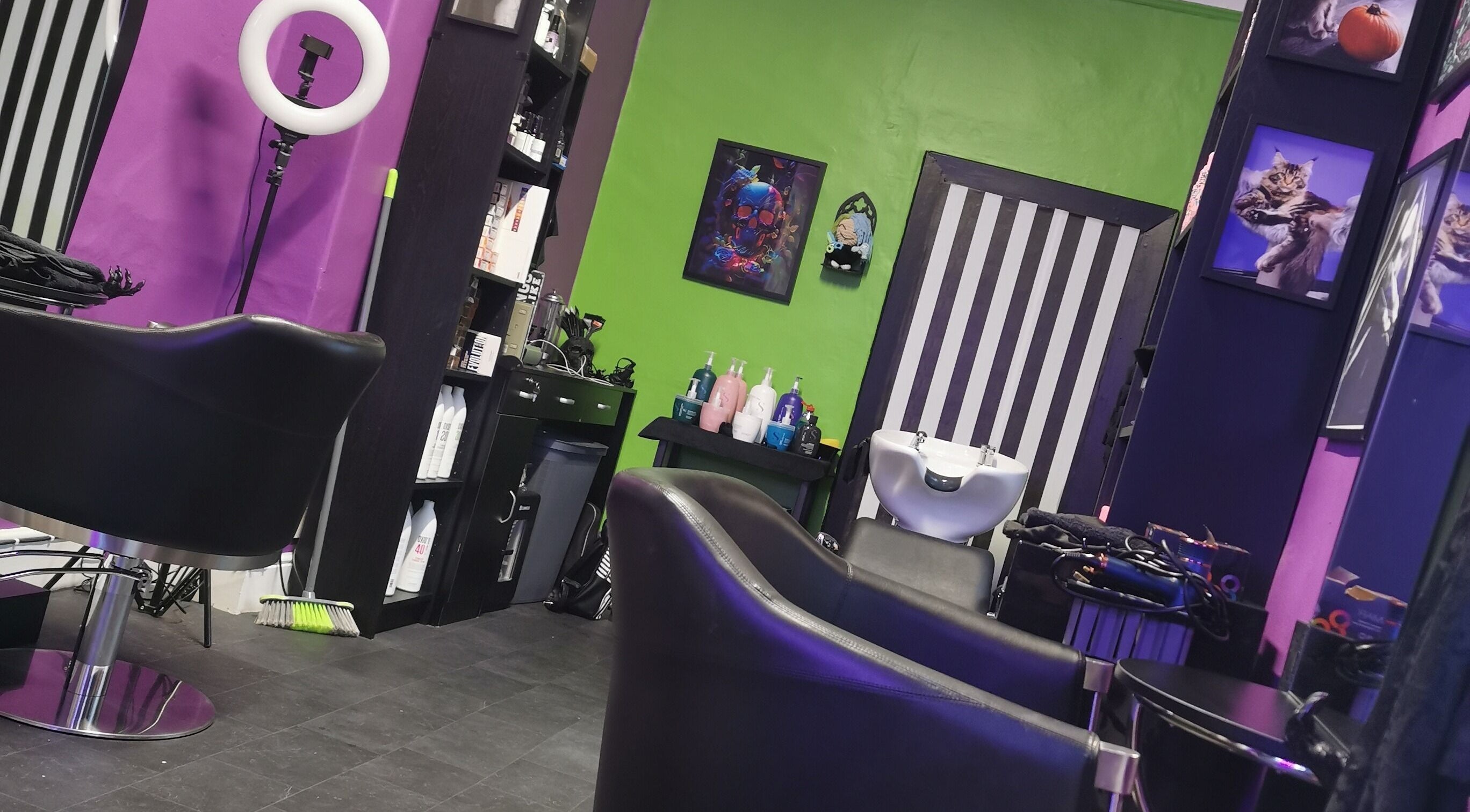 Bold interior of Rebel Manes salon in Drogheda, County Louth, IE featuring bright walls and styling chairs.