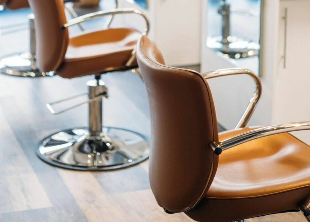 Stylish salon chairs at Finca Beauty Salon - Aina Haina, Honolulu, Hawaii, US, welcoming clients for treatments.