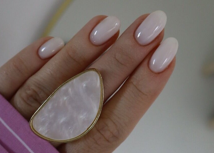 Close-up of manicured nails with a ring at æló beauty, Sola, Rogaland, NO.