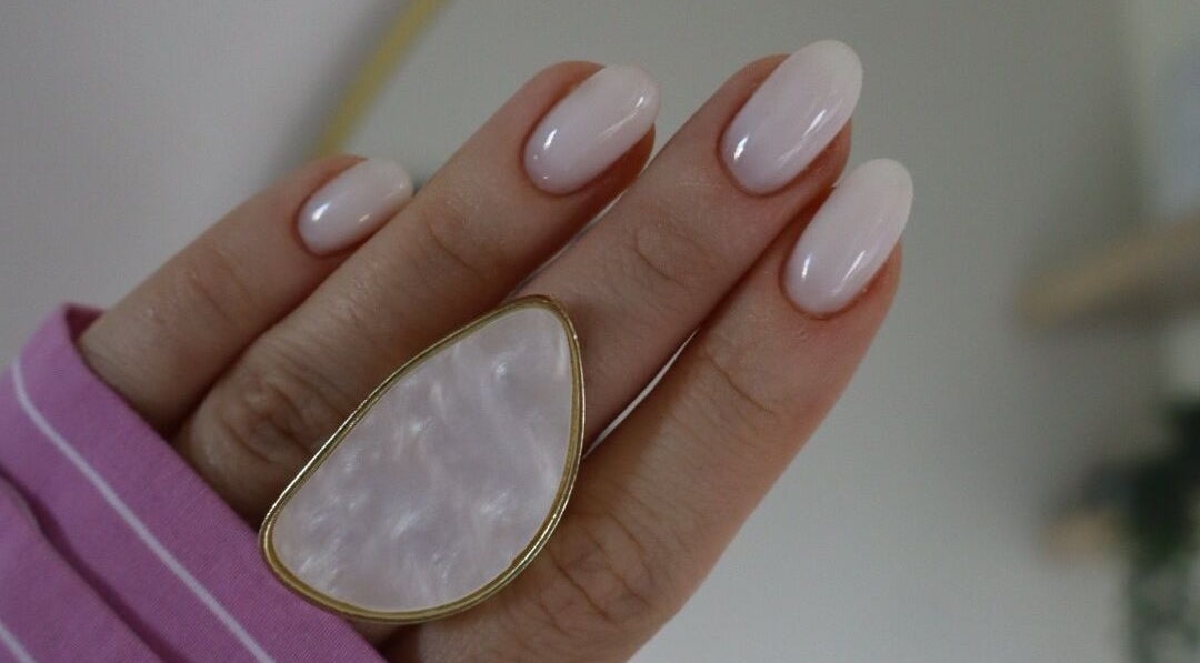 Close-up of manicured nails with a ring at æló beauty, Sola, Rogaland, NO.