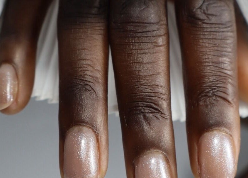 Close-up of polished nails at æló beauty, Sola, Rogaland, NO showcasing glossy finish.