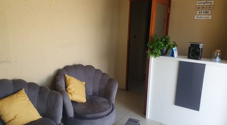 Welcoming reception area at Buhle Bendalo Beauty Spa, featuring elegant chairs in Soweto, Gauteng, ZA.