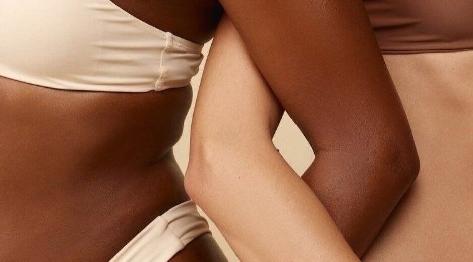 Embrace of diverse skin tones representing beauty at Athenas Aesthetics, Hollywood, Florida, US.