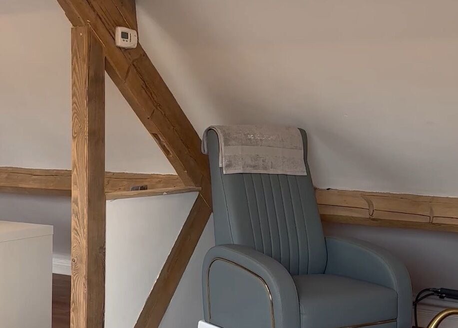 Elegant treatment chair at JL’s Hideaway Beauty & Aesthetics, Bewdley, England, GB, enhancing wellness experience.