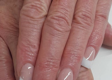 Classic French manicure at NATASHA'S NAILS, Kempton Park, Gauteng, ZA, showcasing precision and elegance.