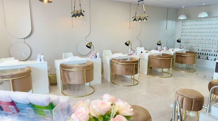 Chic interior of Elle Nail Couture in Boksburg, Gauteng, ZA featuring velvet chairs and modern nail stations.