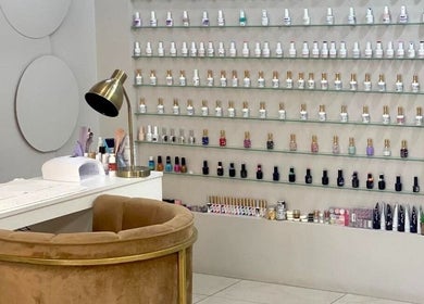 Elegant nail polish display at Elle Nail Couture, Boksburg, Gauteng, ZA, showcasing a modern manicure station.