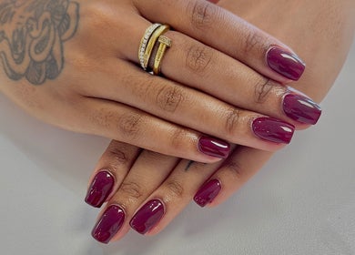Elegant plum manicured nails at Elle Nail Couture, Boksburg, Gauteng, ZA, showcasing refined nail art.