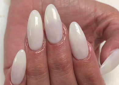 Elegant ivory manicured nails at Elle Nail Couture, Boksburg, Gauteng, ZA, showcasing exquisite nail art.