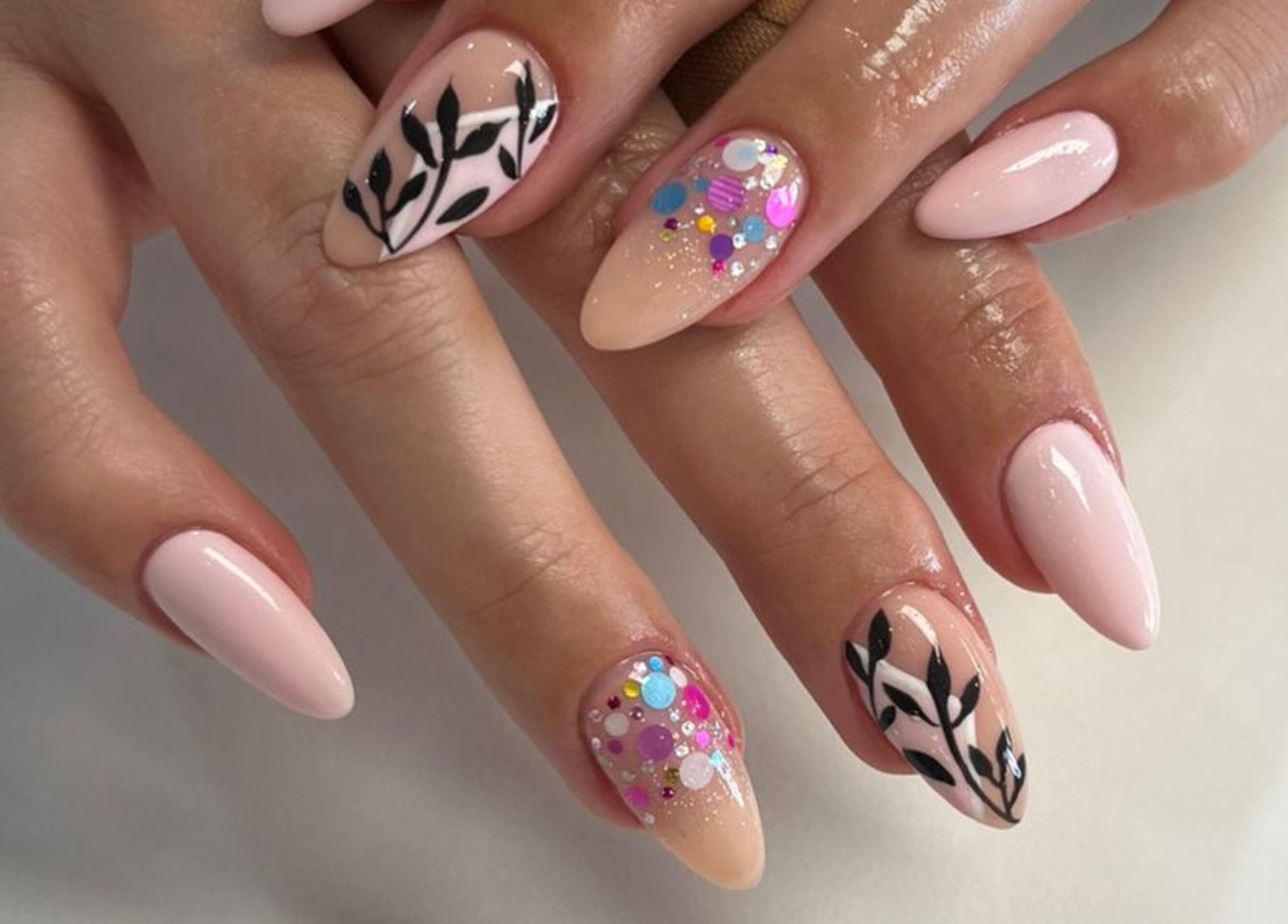 Chic nail art design from Elle Nail Couture, Boksburg, Gauteng, ZA. Features elegant patterns and colorful accents.