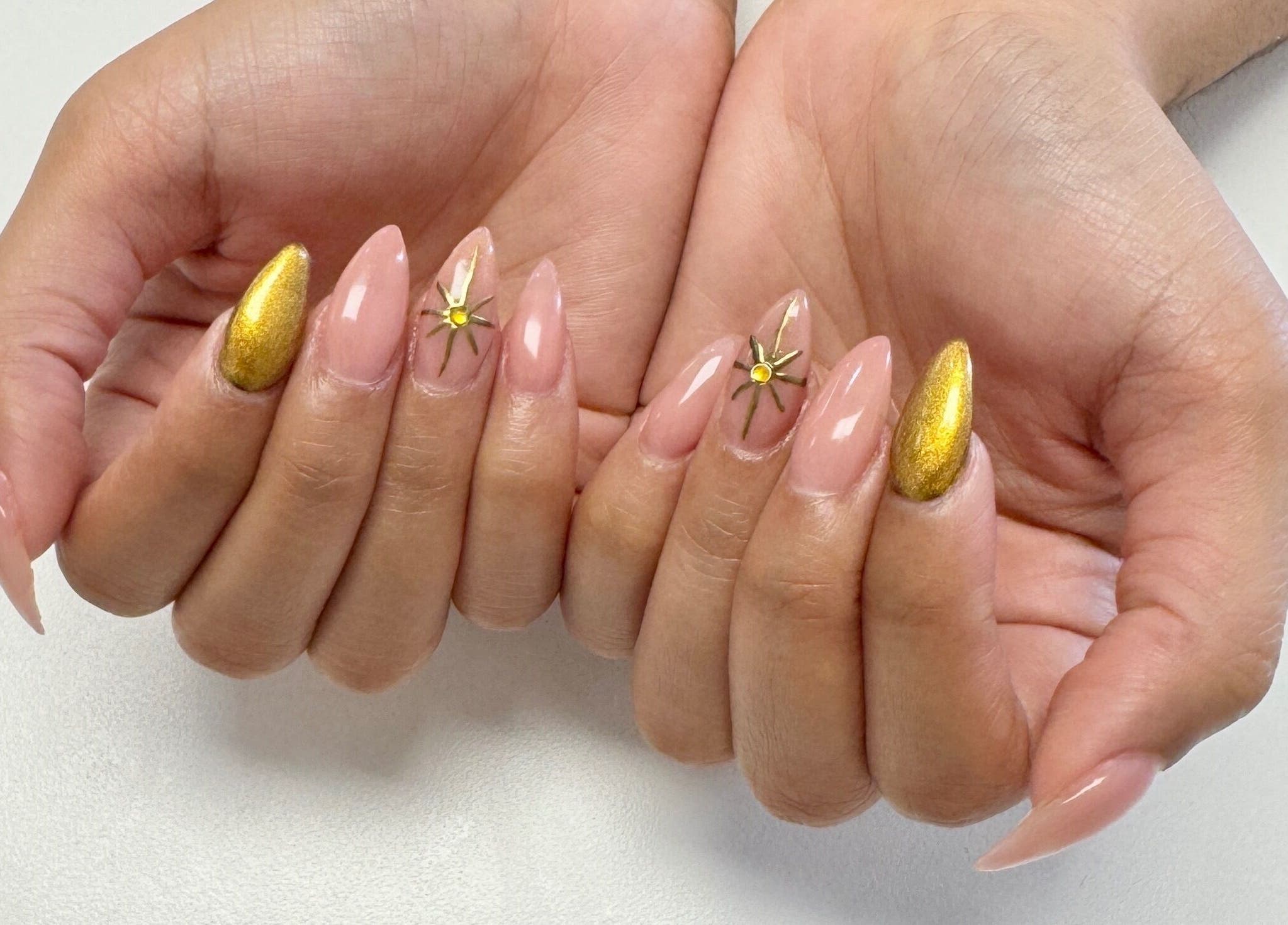 Elegant nail art with gold accents at Elle Nail Couture in Boksburg, Gauteng, ZA.