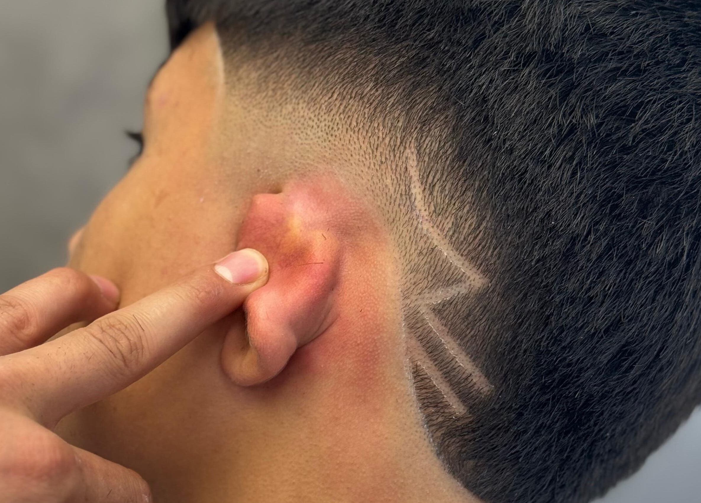 Close-up of trendy fade haircut at Sam’s Barbers London, located in London, England, GB.
