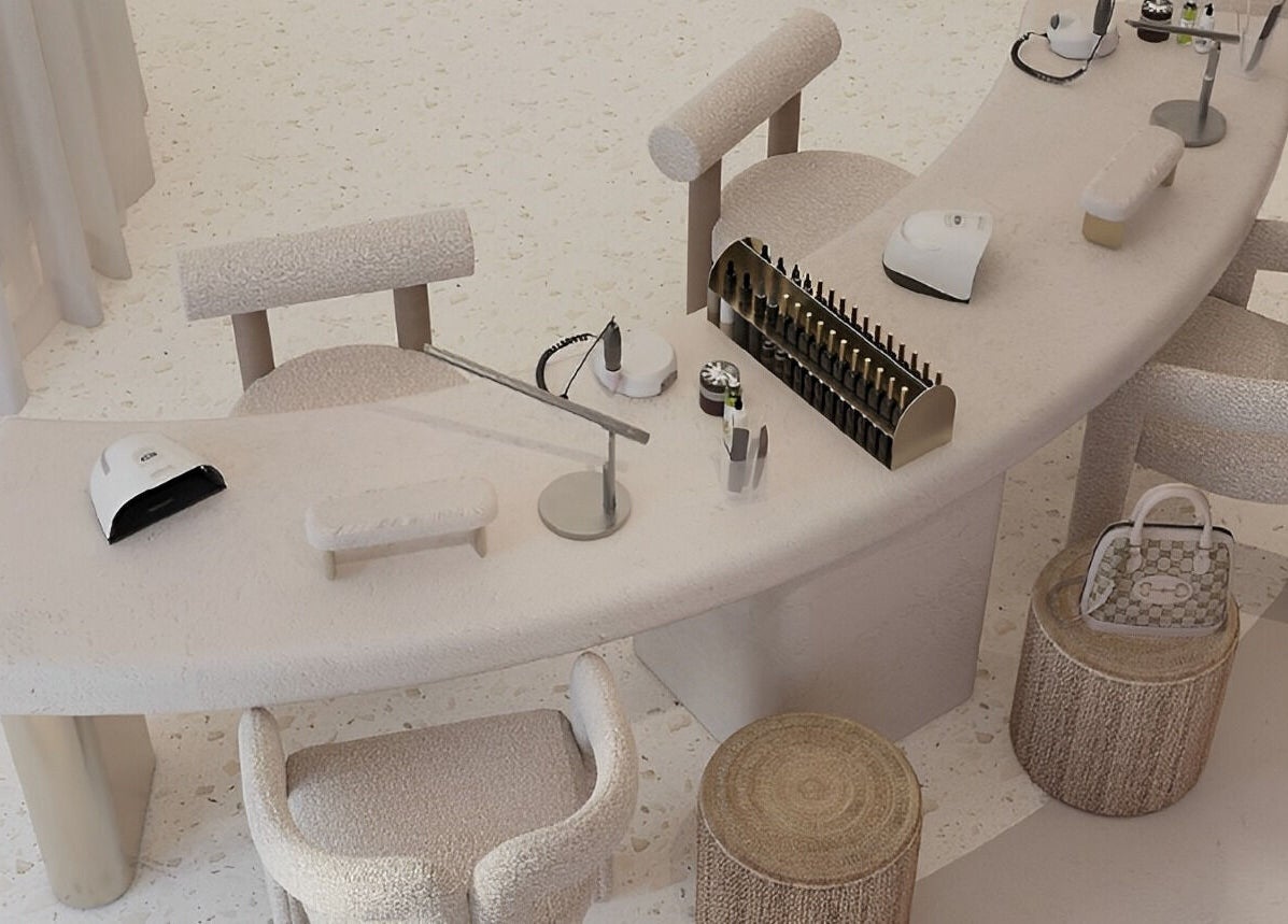 Luci Luna in Dubai, Dubai, AE offers a luxurious nail salon featuring modern white decor and plush seating.