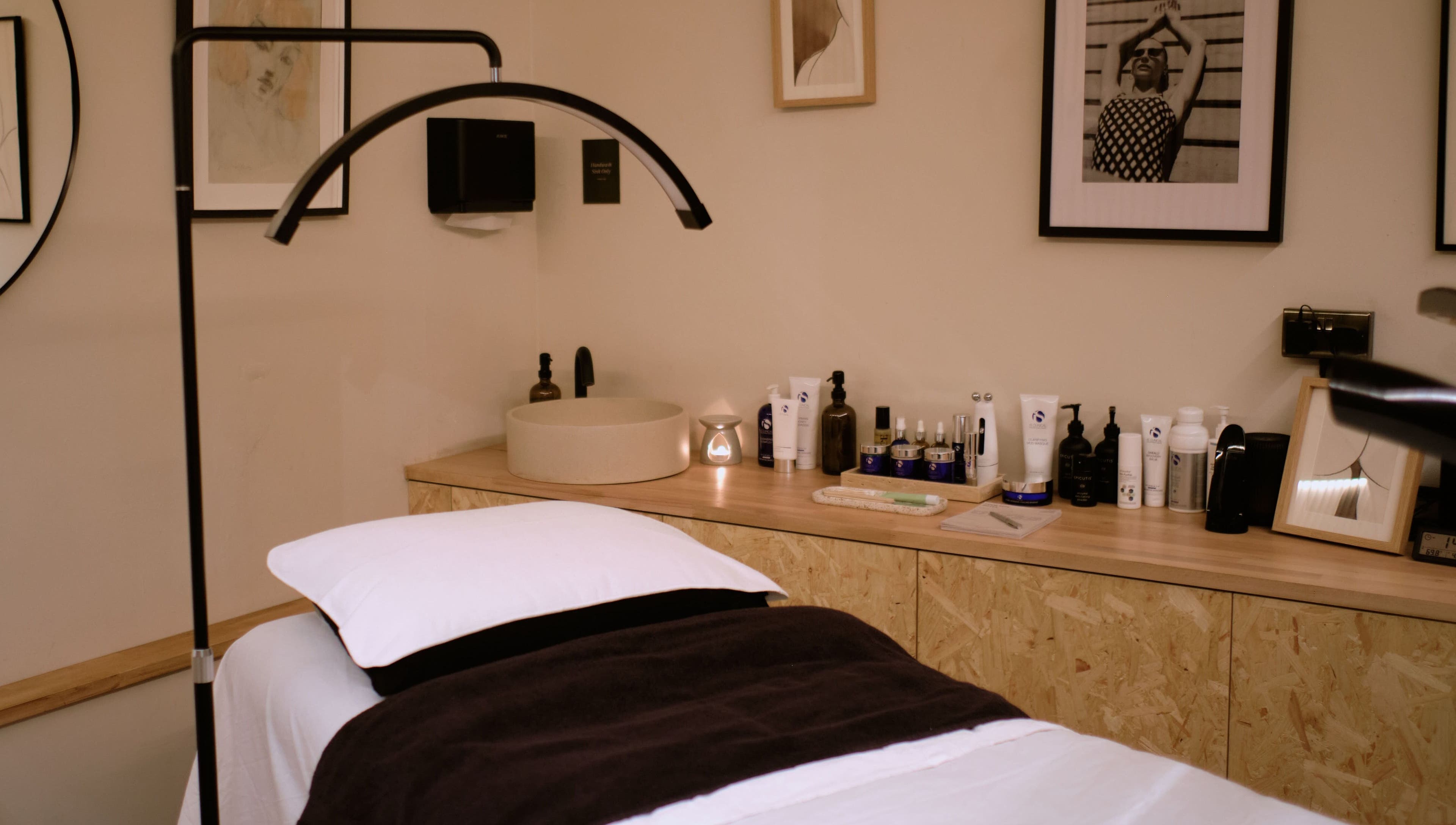 Treatment room at Cleo Rogers Skincare - SHY Studios, featuring cozy bed and skincare products in Lewes, England, GB.